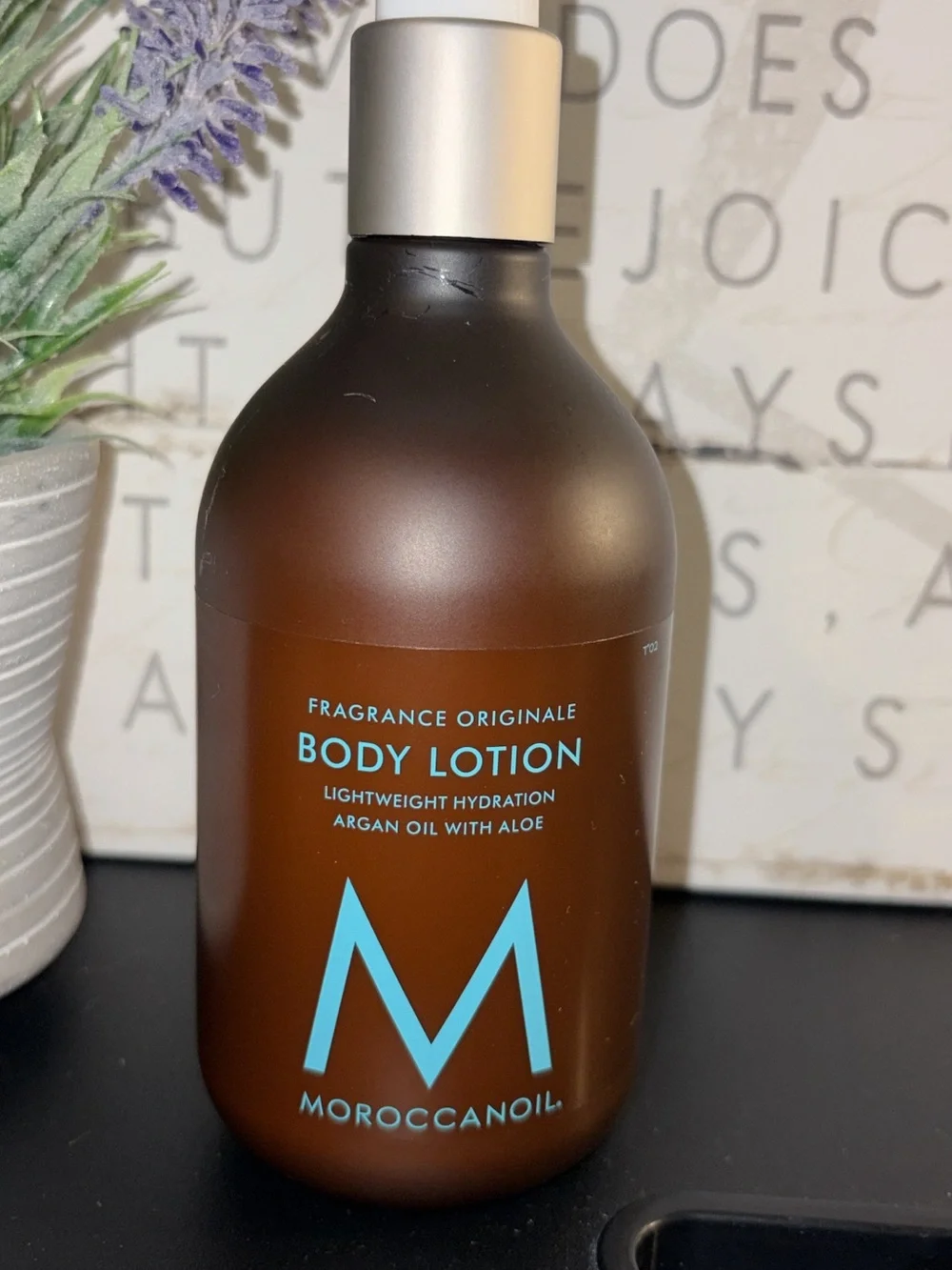 Moroccanoil Light Blue Woven Cosmetic Case & Bottle Body Lotion with M Logo.